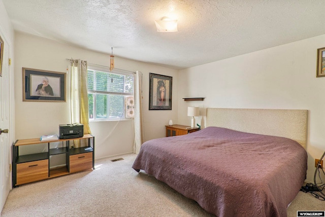 606 Herschler Ave, Evanston, WY 82930 - bedroom featuring light carpet and a textured ceiling