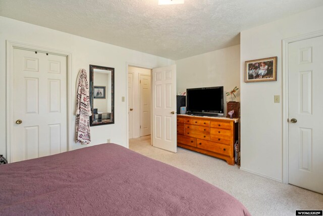 606 Herschler Ave, Evanston, WY 82930 - bedroom with light carpet and a textured ceiling