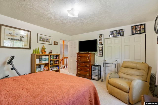 606 Herschler Ave, Evanston, WY 82930 - bedroom with light colored carpet, a textured ceiling, and a closet