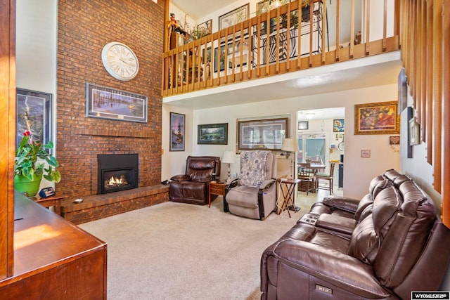 606 Herschler Ave, Evanston, WY 82930 - living room with a high ceiling, carpet, and a brick fireplace