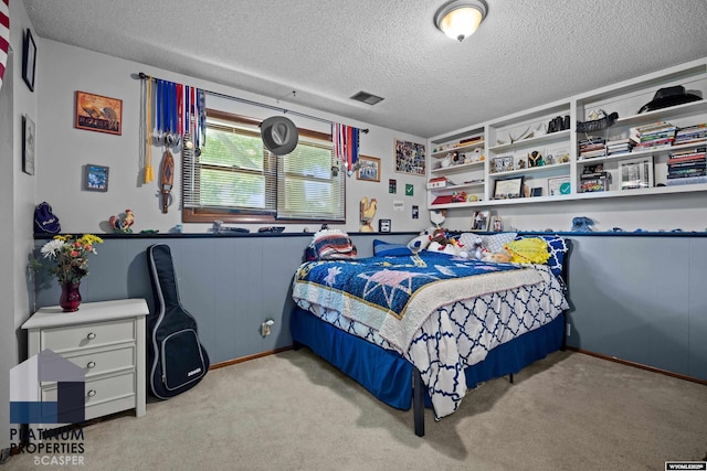3440 E 18th St, Casper, WY 82609 - bedroom with a textured ceiling and carpet