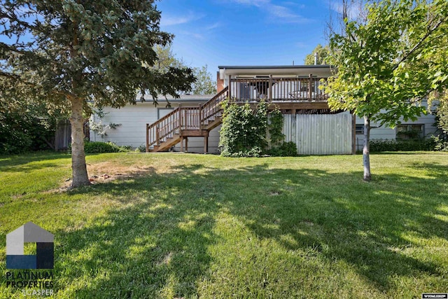 3440 E 18th St, Casper, WY 82609 - view of grassy yard with stairs and a deck