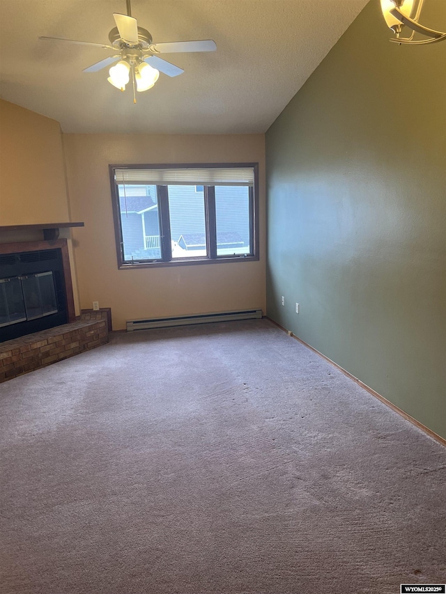 6358 Buckboard Rd, Casper, WY 82604 - unfurnished living room with a baseboard heating unit, carpet floors, a ceiling fan, and a brick fireplace