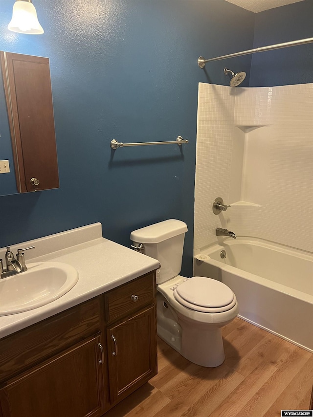 6358 Buckboard Rd, Casper, WY 82604 - bathroom featuring wood finished floors, vanity, and shower / bathtub combination