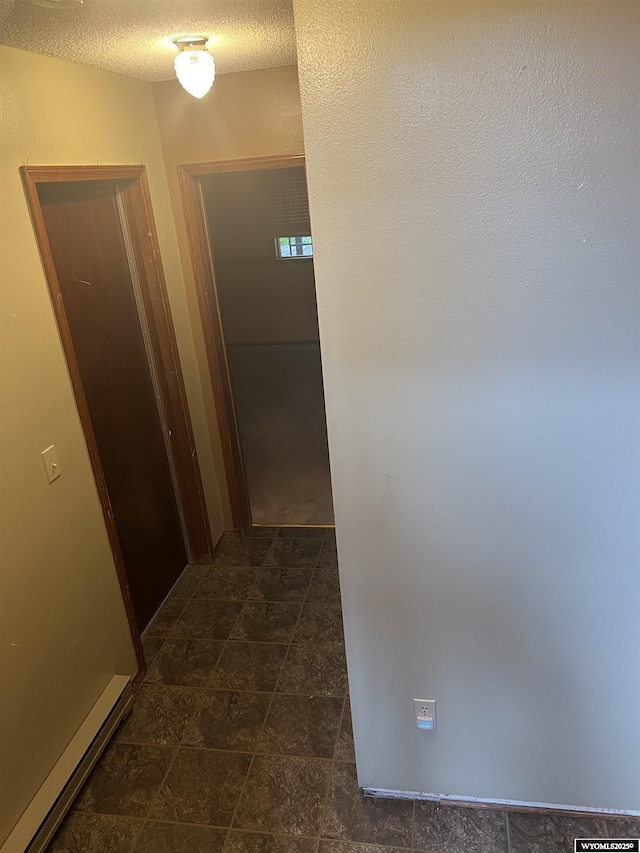 6358 Buckboard Rd, Casper, WY 82604 - corridor with a textured ceiling