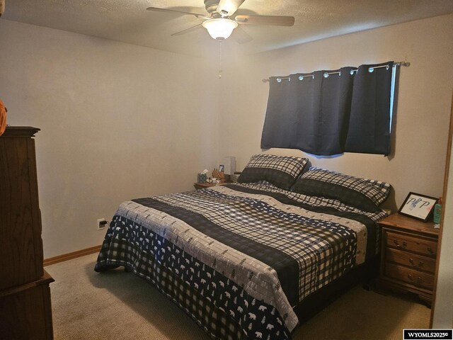1150 Park View Dr, Green River, WY 82935 - bedroom featuring carpet flooring and a ceiling fan