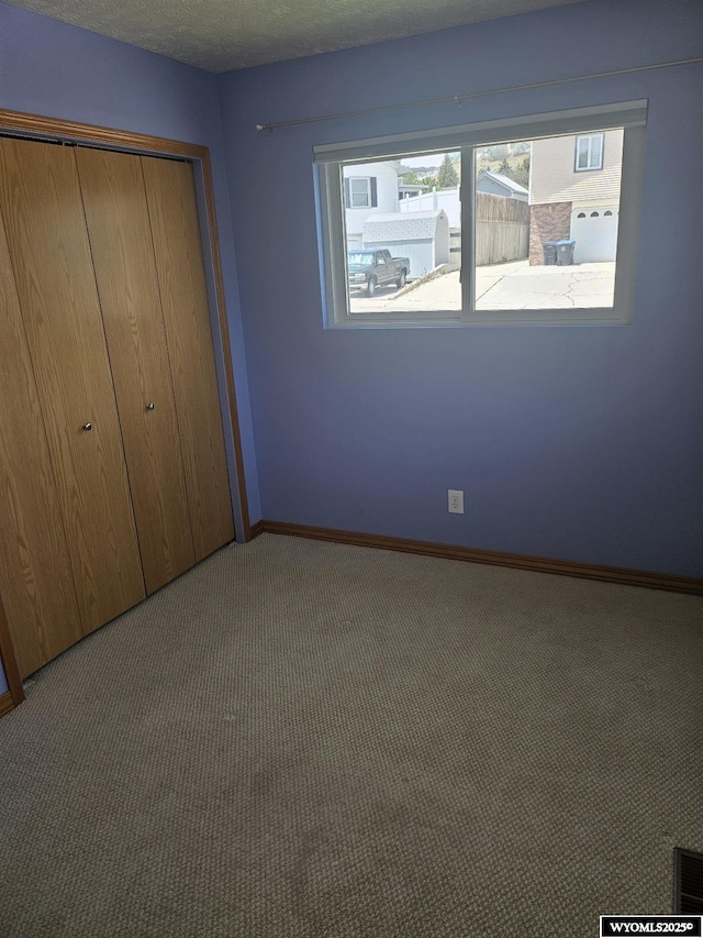 1150 Park View Dr, Green River, WY 82935 - unfurnished bedroom featuring carpet and a closet