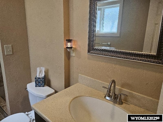 1150 Park View Dr, Green River, WY 82935 - bathroom with a textured wall and vanity