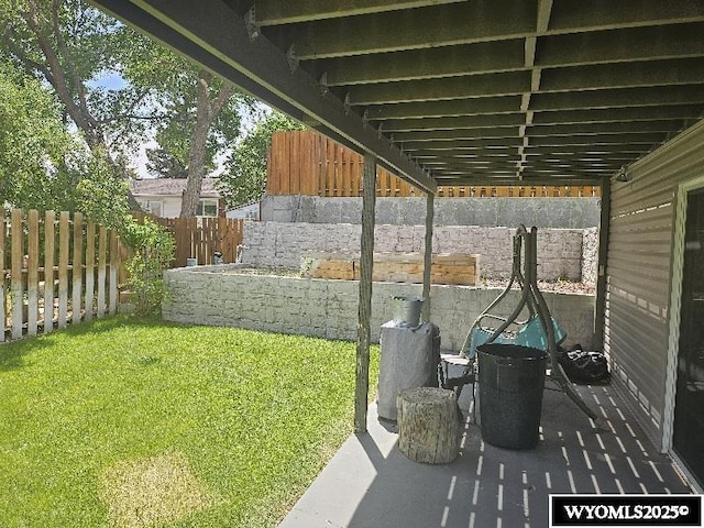1150 Park View Dr, Green River, WY 82935 - fenced backyard featuring a patio area