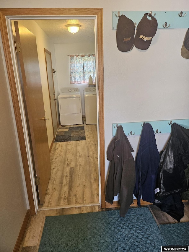1150 Park View Dr, Green River, WY 82935 - mudroom with washer and clothes dryer and wood finished floors