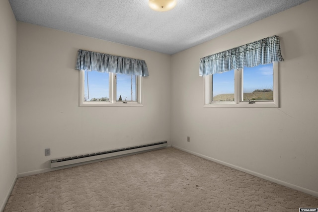 4450 S Skyline Rd, Casper, WY 82604 - carpeted spare room with a baseboard radiator and a textured ceiling