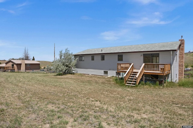 4450 S Skyline Rd, Casper, WY 82604 - rear view of house with a wooden deck, a yard, and stairs