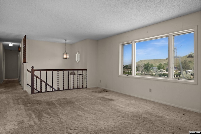 4450 S Skyline Rd, Casper, WY 82604 - unfurnished room featuring a textured ceiling and carpet floors