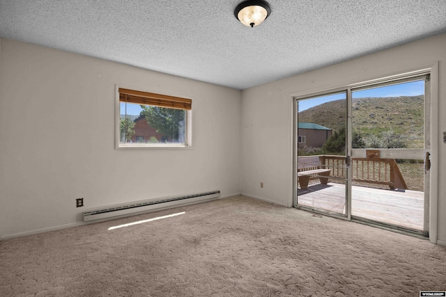 4450 S Skyline Rd, Casper, WY 82604 - unfurnished room with baseboard heating, carpet, and a textured ceiling