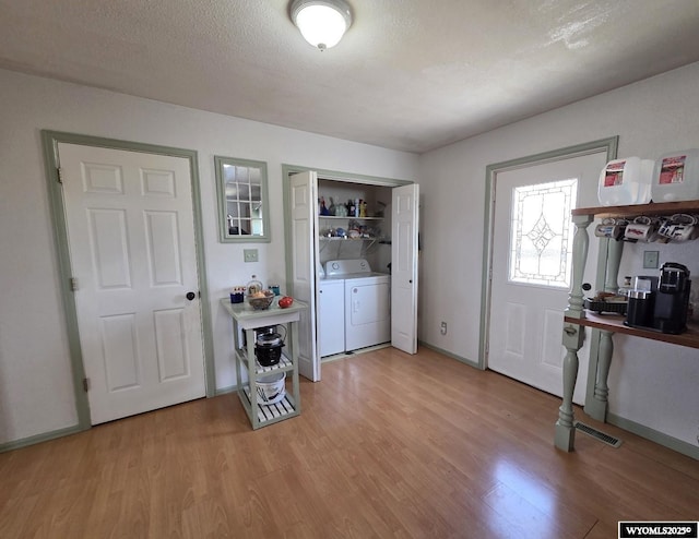 7866 Scorpion Way, Evansville, WY 82636 - interior space featuring separate washer and dryer and light wood-style flooring