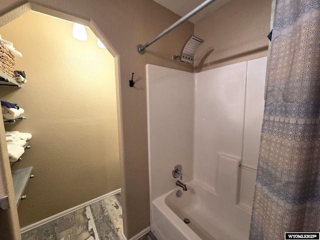7866 Scorpion Way, Evansville, WY 82636 - bathroom featuring shower / tub combo and baseboards