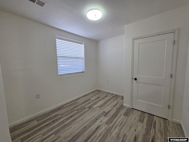 7866 Scorpion Way, Evansville, WY 82636 - empty room featuring wood finished floors and baseboards