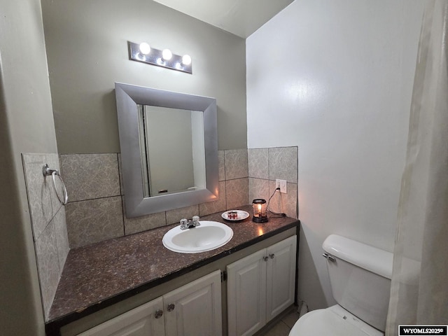 7866 Scorpion Way, Evansville, WY 82636 - bathroom featuring vanity and tasteful backsplash