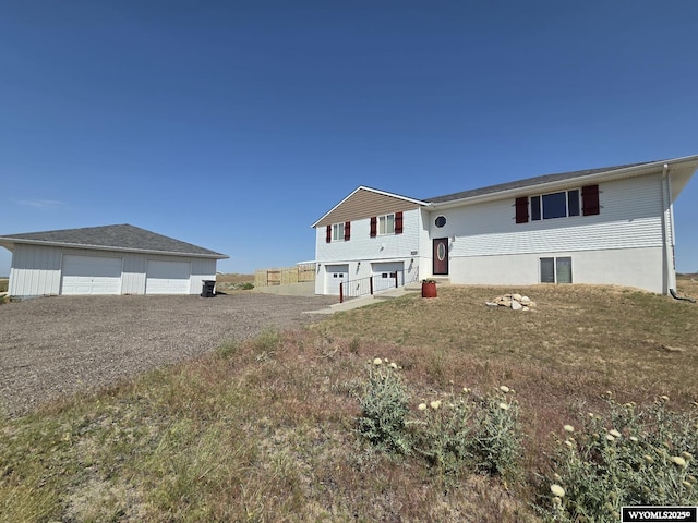 7866 Scorpion Way, Evansville, WY 82636 - view of front facade with a garage and an outdoor structure