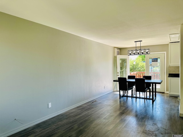 829 Belinda Dr, Riverton, WY 82520 - dining room with dark wood-style flooring and baseboards