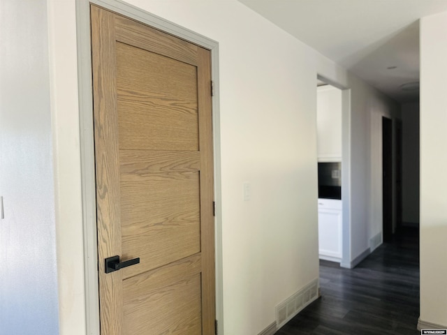 829 Belinda Dr, Riverton, WY 82520 - hallway featuring dark wood-type flooring and baseboards