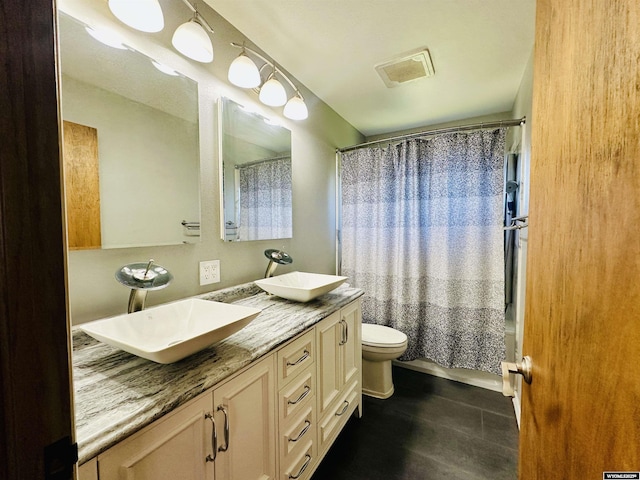 829 Belinda Dr, Riverton, WY 82520 - full bath with double vanity and shower / bath combo with shower curtain