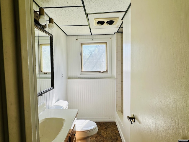 829 Belinda Dr, Riverton, WY 82520 - full bath with vanity, a wainscoted wall, and shower / tub combination