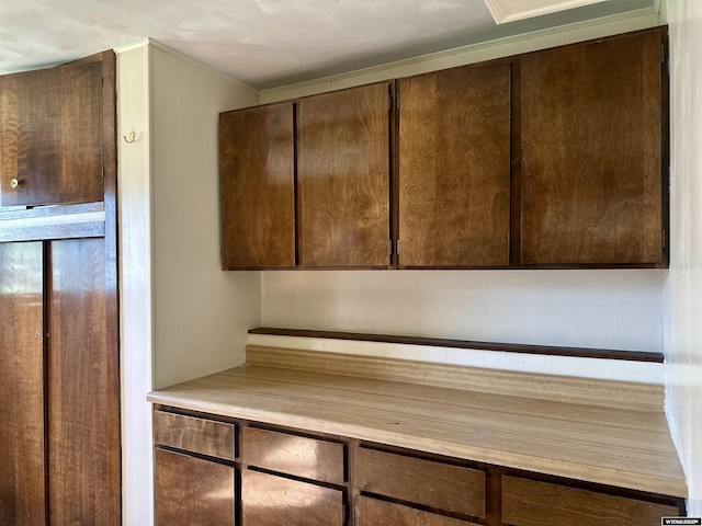 829 Belinda Dr, Riverton, WY 82520 - kitchen featuring dark brown cabinets and light countertops