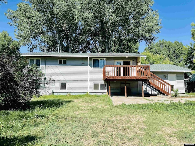 829 Belinda Dr, Riverton, WY 82520 - rear view of house with stairway, a lawn, a deck, and a patio