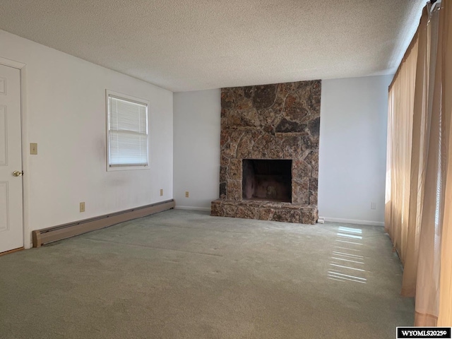 1630 Coulson Dr, Rawlins, WY 82301 - unfurnished living room with a baseboard heating unit, carpet floors, a fireplace, and a textured ceiling