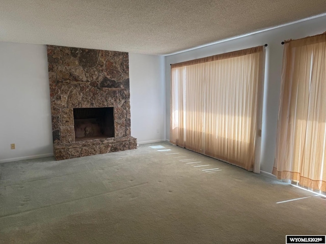 1630 Coulson Dr, Rawlins, WY 82301 - unfurnished living room featuring carpet, a textured ceiling, and a fireplace