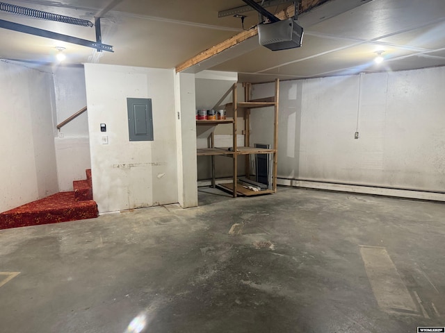 1630 Coulson Dr, Rawlins, WY 82301 - garage featuring electric panel, a garage door opener, and a baseboard heating unit