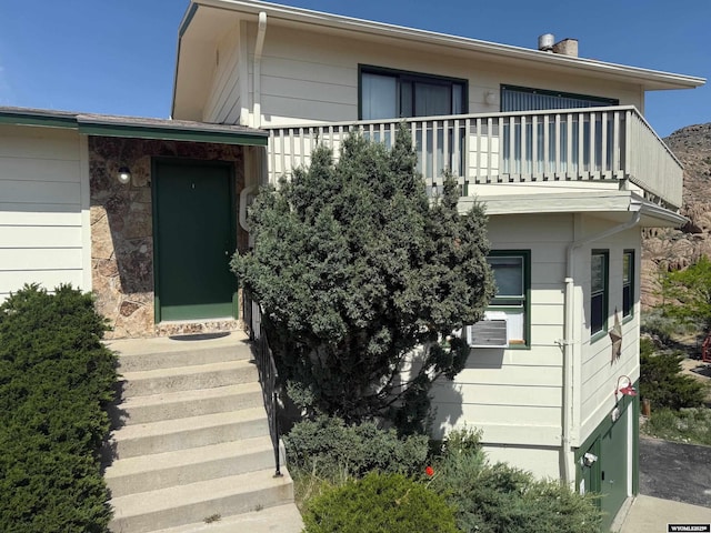 1630 Coulson Dr, Rawlins, WY 82301 - view of front facade featuring a balcony and cooling unit