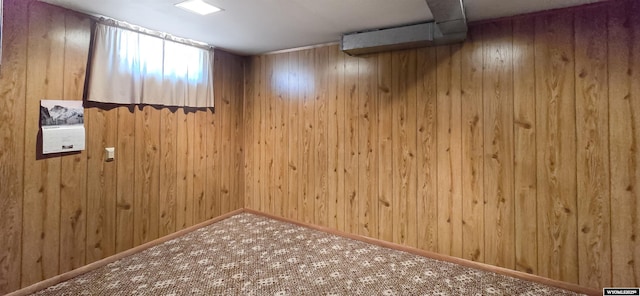 335 E 11th St, Casper, WY 82601 - basement with carpet floors and wooden walls