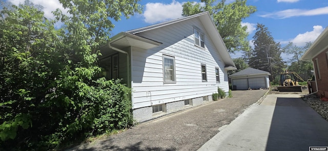 335 E 11th St, Casper, WY 82601 - view of property exterior with a garage and an outbuilding