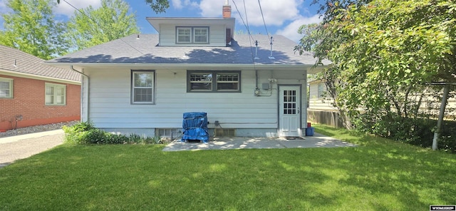 335 E 11th St, Casper, WY 82601 - back of property featuring a chimney, roof with shingles, and a patio area
