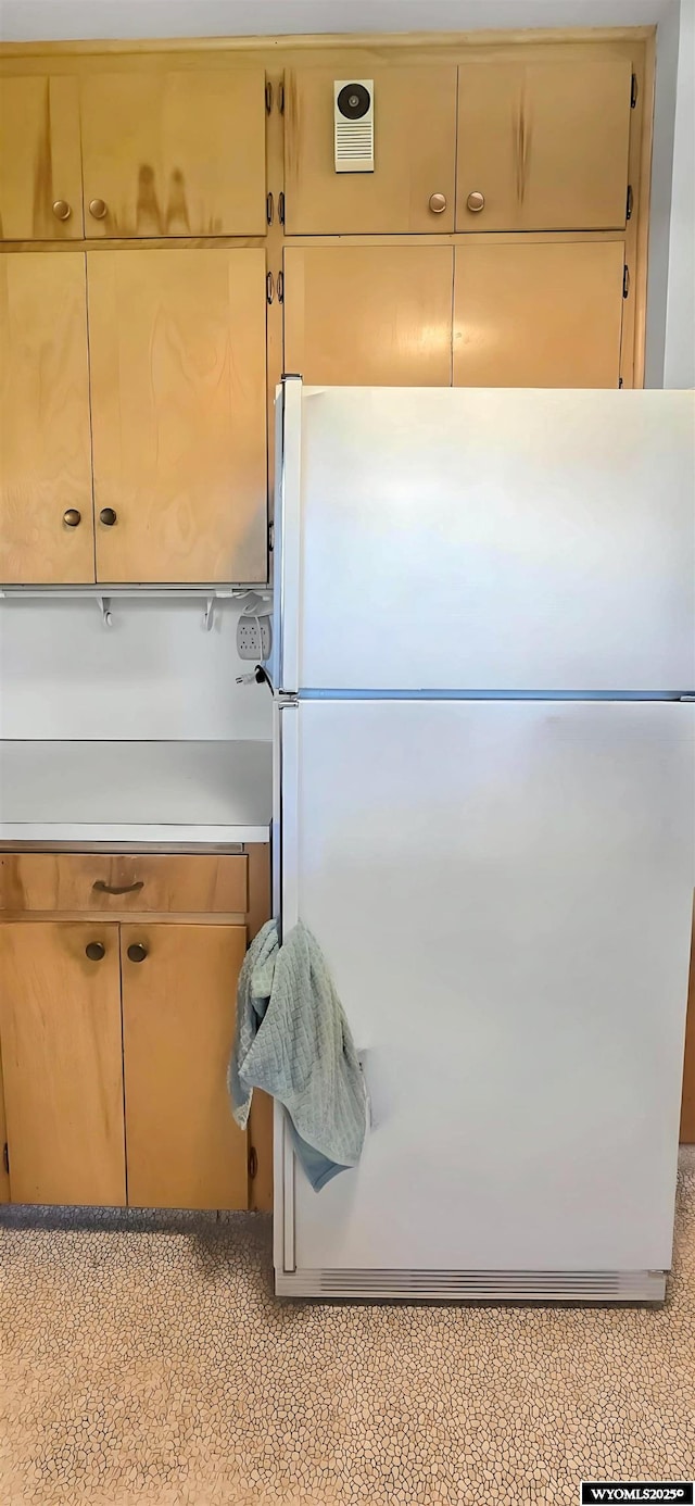 335 E 11th St, Casper, WY 82601 - kitchen with freestanding refrigerator and light countertops