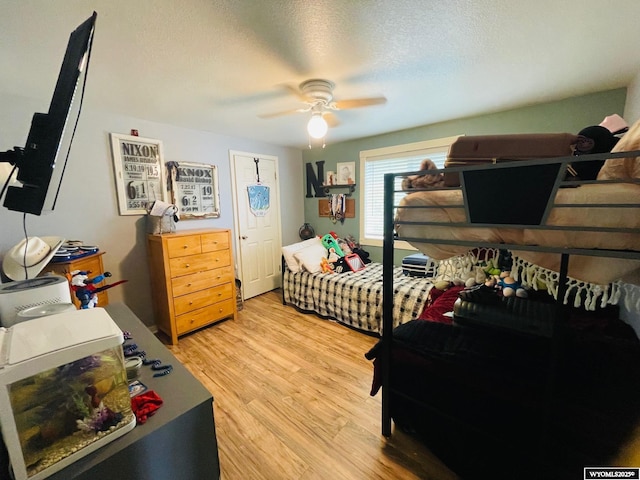1328 Canyon Ct, Kemmerer, WY 83101 - bedroom featuring light wood finished floors, a ceiling fan, and a textured ceiling