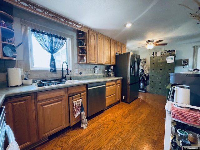 1328 Canyon Ct, Kemmerer, WY 83101 - kitchen featuring stainless steel appliances, open shelves, a ceiling fan, brown cabinetry, and tasteful backsplash