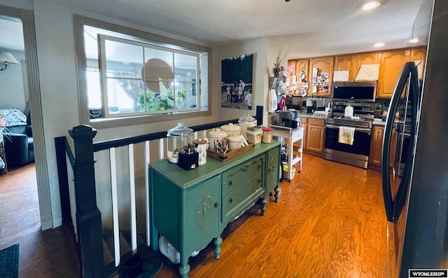 1328 Canyon Ct, Kemmerer, WY 83101 - kitchen with appliances with stainless steel finishes, light wood-type flooring, recessed lighting, and light countertops