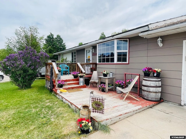 1328 Canyon Ct, Kemmerer, WY 83101 - deck featuring a lawn