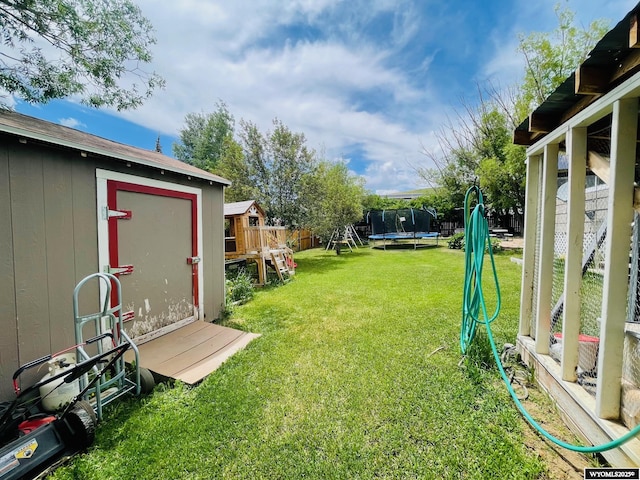 1328 Canyon Ct, Kemmerer, WY 83101 - view of yard with a shed, a trampoline, and a playground