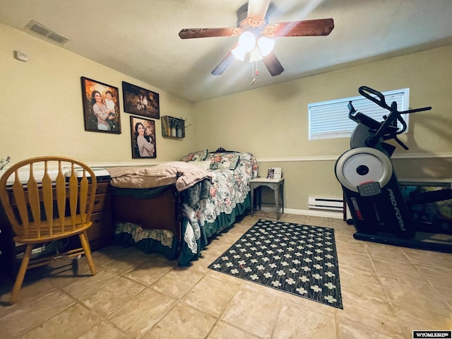 1328 Canyon Ct, Kemmerer, WY 83101 - tiled bedroom featuring baseboard heating and a ceiling fan