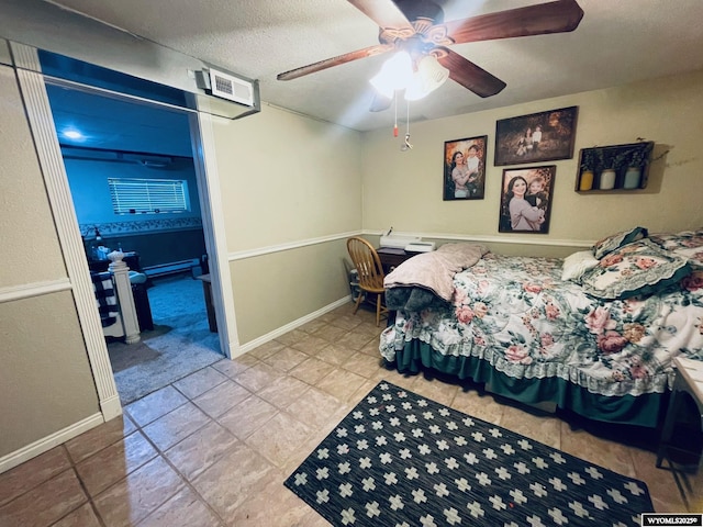 1328 Canyon Ct, Kemmerer, WY 83101 - bedroom featuring a textured ceiling, a ceiling fan, and tile patterned flooring