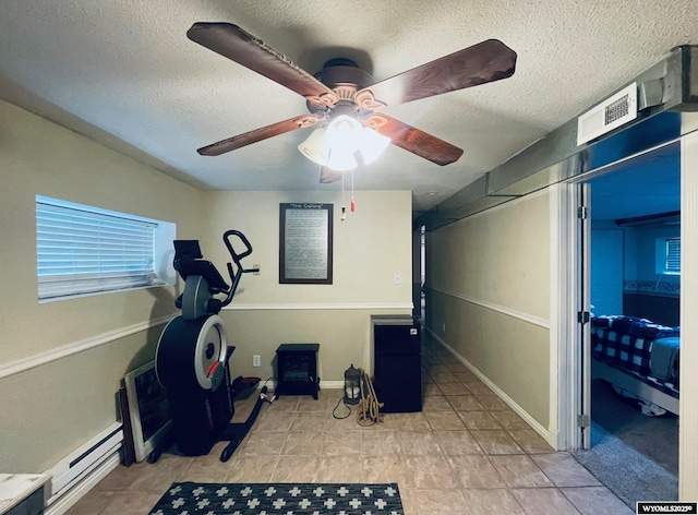 1328 Canyon Ct, Kemmerer, WY 83101 - workout room featuring a textured ceiling and a ceiling fan