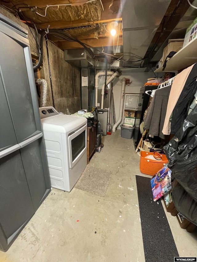 1328 Canyon Ct, Kemmerer, WY 83101 - unfinished below grade area featuring washer / dryer and heating unit