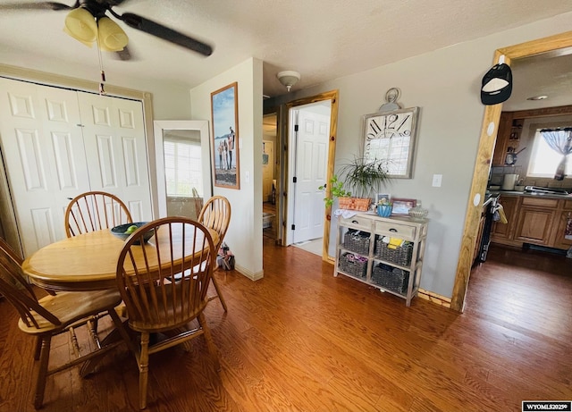 1328 Canyon Ct, Kemmerer, WY 83101 - dining area featuring a ceiling fan and dark wood-style flooring