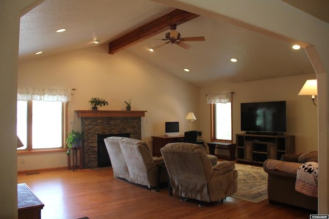1540 Manor Dr, Casper, WY 82609 - living area featuring healthy amount of natural light, a stone fireplace, wood finished floors, ceiling fan, and recessed lighting