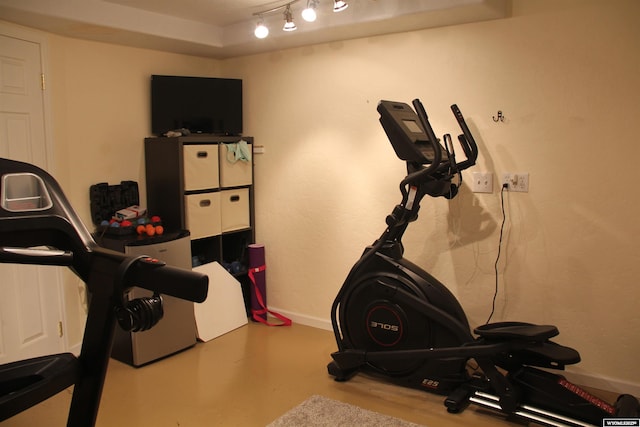 1540 Manor Dr, Casper, WY 82609 - exercise room with track lighting and baseboards