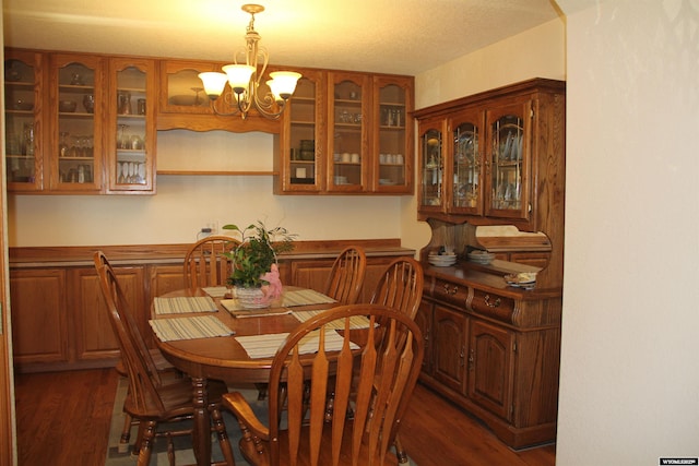 1540 Manor Dr, Casper, WY 82609 - dining space featuring a chandelier and dark wood-type flooring